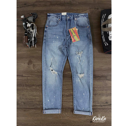 Painted and distressed washed red denim pants