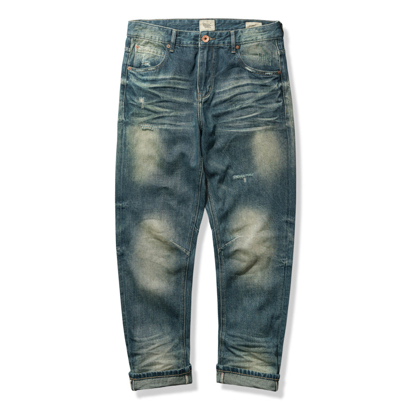 Vintage blue denim pants with three-dimensional beard and washed finish