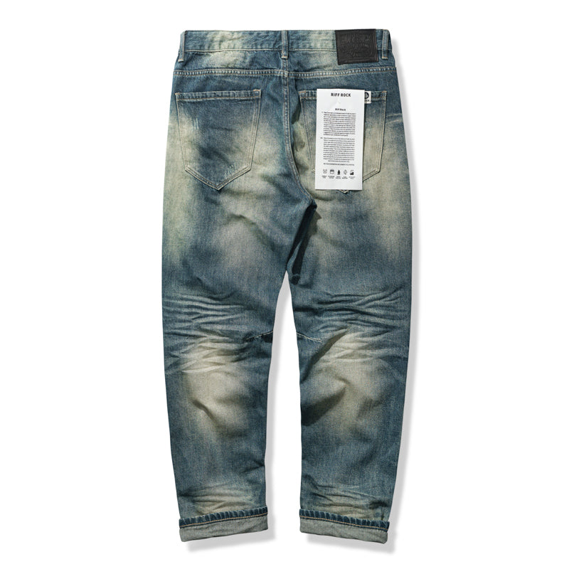 Vintage blue denim pants with three-dimensional beard and washed finish